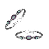 Handcrafted silver bracelet with mystic quartz stones in woven Bali design.